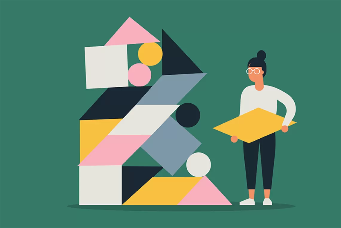 Woman holding missing piece of structure.