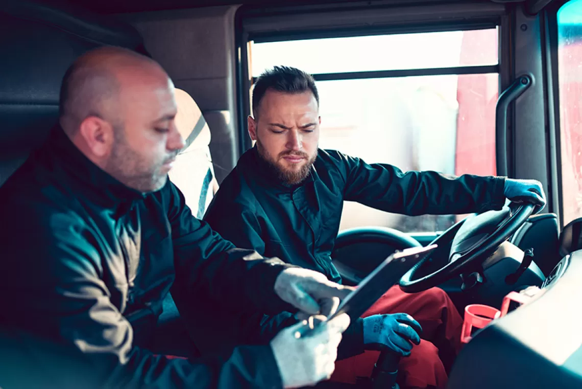 Manager training truck driver.