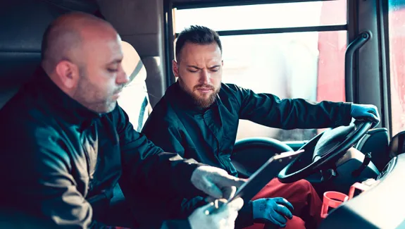 Manager training truck driver.