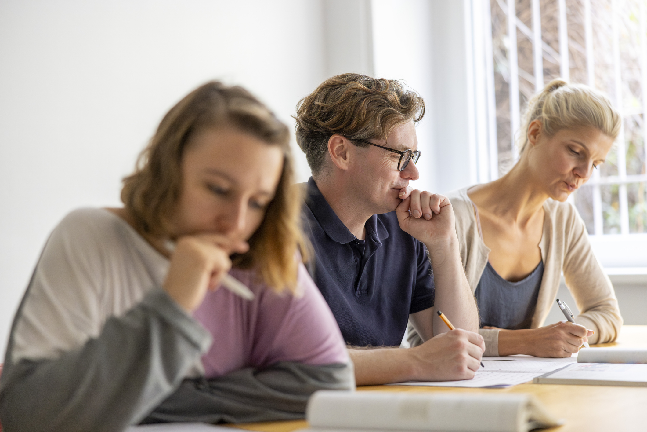 Several adults studying