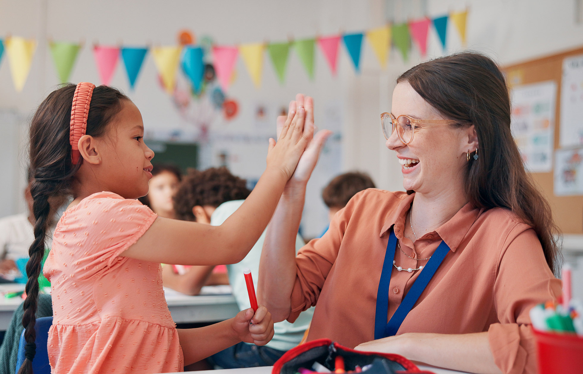 Learner and BCBA sharing a high five