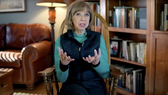 Janis Allen hosting a video from her living room