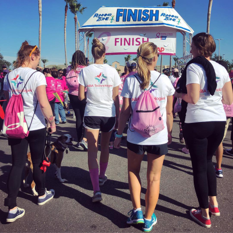 Students walking together at an event - almost crossing the finish line.