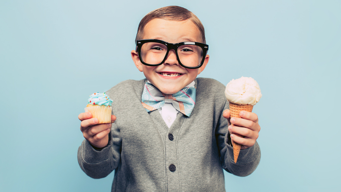 Boy with a cupcake and ice cream cone
