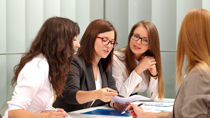 Supervisor talking to supervisees