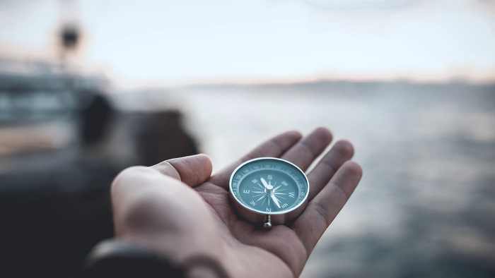 Sailor holding a compass