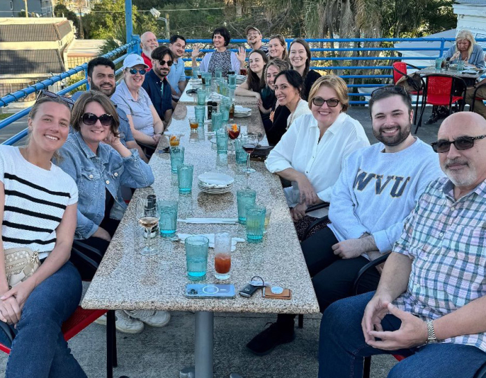 ABA Technologies team members having dinner al fresco