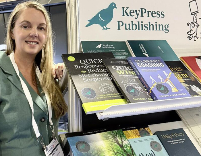 Adele Hall at KeyPress Publishing booth at a publishers' conference