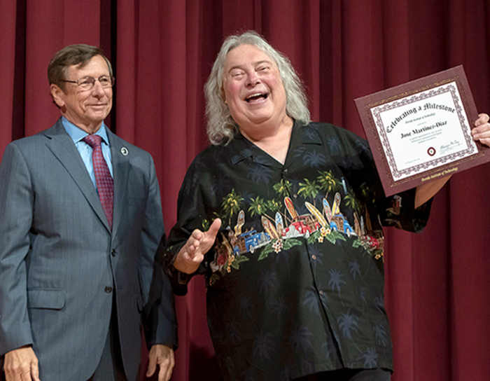 Jose Martinez-Diaz receiving achievement award