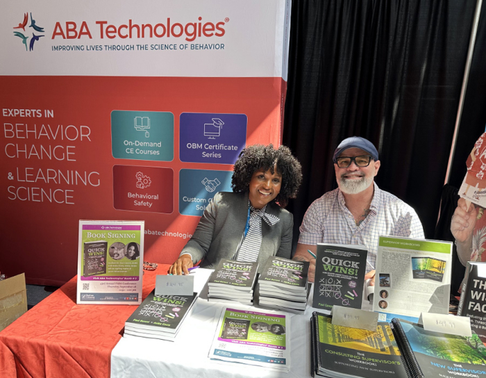 Anika Costa and Paulie Gavoni at the ABA Tech conference booth signing their book "Quick Wins," published by KeyPress Publishing