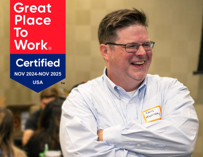 ABA Tech CEO Chris Morrissey with the Great Place to Work certification flag