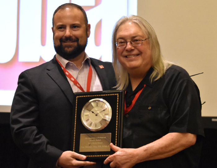 Jose Martinez-Diaz receiving an award from APBA