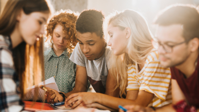 diverse group of young adults studying
