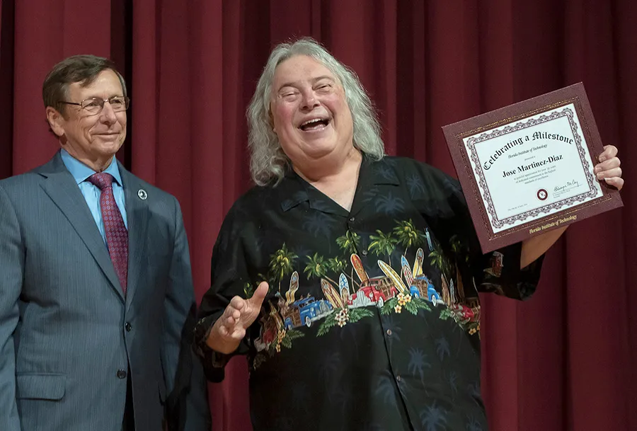 ABA Tech founder Jose Martinez-Diaz accepting an achievement award